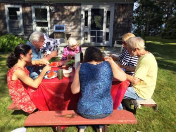 The Thayer clan and cousin Rich have a lobster feed at the cottage on the Fourth of July. SUZI THAYER/Boothbay Register