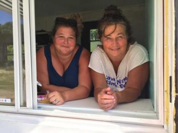 Mindy Jones, left, and her mom, Carol Heaberlin, at the take-out window of their new business, Y-Knot Gourmet Sandwiches and Desserts, on Route 1 in Newcastle. SUZI THAYER/Boothbay Register