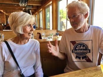 Pete describes the huge fish he caught, to mum, at Robinson’s Wharf on July 2. (Kidding about the fish. I have no idea what he was telling her about :-). SUZI THAYER/Boothbay Register