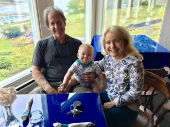The new owners of Smuggler’s Cove Inn and the 1820 House, Alan and Marge Firpo, in the dining room with their grandson, Bryson. SUZI THAYER/Boothbay Register