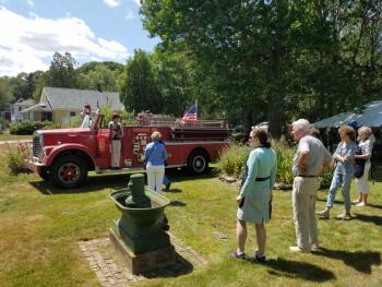 Crowds gather and take pictures around Charlie Bamberg’s vintage 1957 pumper truck. KATRINA RICKERMANN/Boothbay Register