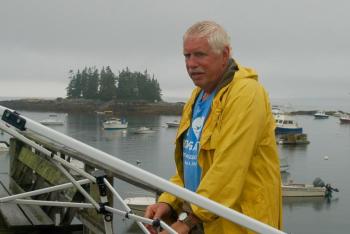 Volunteer Erik Bertelsen takes down the registration tent. ART MAYERS/Boothbay Register