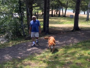 Nate Cushman and his dog, Maggie, leave Barrett’s Park. SUZI THAYER/Boothbay Register