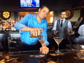 Rob Carlin mixes up a couple manhattans at the country club. SUZI THAYER/Boothbay Register