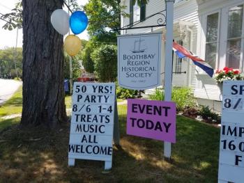 Signs in front of the Historical Society welcome visitors. KATRINA RICKERMANN/Boothbay Register