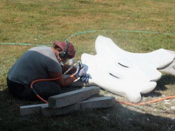 Isabel Catherine Kelley of Portland is totally in the zone finishing up her sculpture for the evening gala. LISA KRISTOFF/Boothbay Register Isabel Catherine Kelley of Portland
