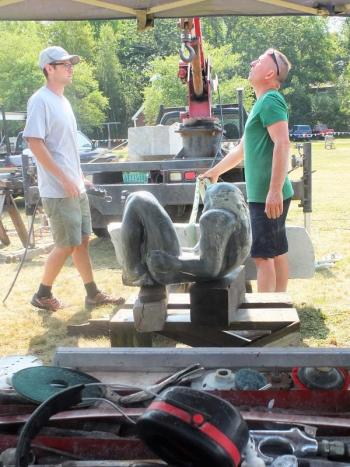 Prepping to install the nude onto its base. LISA KRISTOFF/Boothbay Register