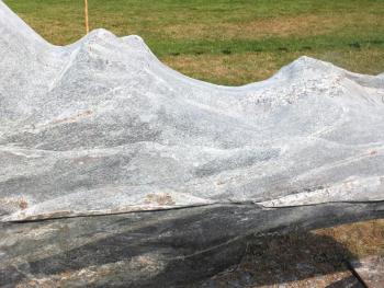Closeup of wave-water action in this Heritage granite sculpture by Bill Royall of Southport. LISA KRISTOFF/Boothbay Register Bill Royall, Southport ME