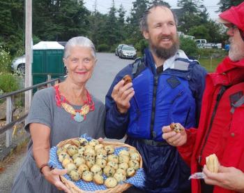 Founder Susan Quinby offers muffins to paddlers. ART MAYERS/Boothbay Register