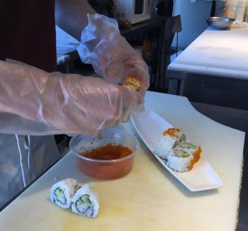 Wendell Thayer demonstrates the fine art of making sushi. SUZI THAYER/Boothbay Register