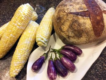 An end of summer meal, with native corn on the cob, Fairytale eggplants, and good bread. SUZI THAYER/Boothbay Register