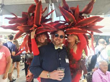 The Slick’s twins, Adele, left, and Andy, right, flank Fishin’ for Fashion emcee Michael Maxim at the Boothbay Harbor Oceanside Golf Resort. SUZI THAYER/Boothbay Register