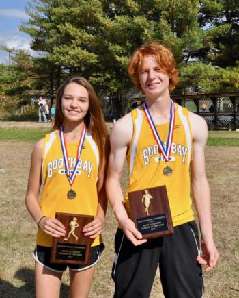Haley Abbott and Blake Erhard hold their plaques for MVC Runner of the Year. Courtesy of Kerrin Erhard