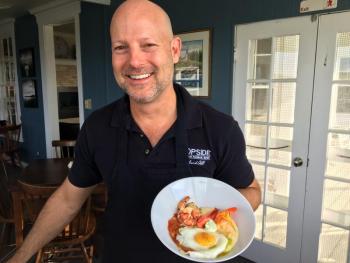 Mark Osborn shows off one of his gourmet savory breakfasts on Oct. 22. SUZI THAYER/Boothbay Register