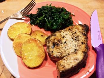 Grilled swordfish with roasted yellow flesh potatoes and sauteed spinach. SUZI THAYER/Boothbay Register