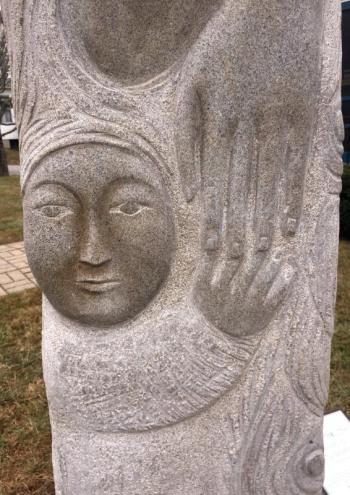 Closeup of child starting to let go of “Mother’s” hand, Lise Becu sculpture. Lise Becu
