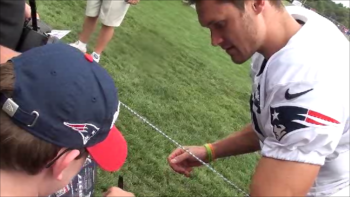 Chris Hogan gives Jason an autograph. Courtesy of Sam Michael
