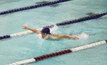 Dolphin swimmer Graham Harris competes in a butterfly event at the Bath meet. STEVE EDWARDS/Boothbay Register