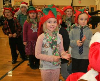Excited elves have a quick chat with Santa Claus. LISA KRISTOFF/Boothbay Register