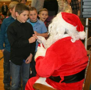 Don’t you love watching the expressions of kids in line – especially to see the chief elf himself? LISA KRISTOFF/Boothbay Register