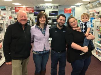 Russell Brackett, left, Leisha McDonald, and Nick, Emily and the star of the show, Oscar Mirabile, at Harbor-Tech Solutions in Boothbay Harbor. SUZI THAYER/Boothbay Register