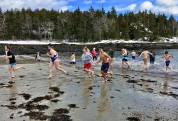 After the plunge, the Leprechaun Leapers head back to towels and warm cars. SUZI THAYER/Boothbay Register