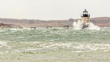 Ram Island Light gets hit by ocean waves. Courtesy of Mike Leonard