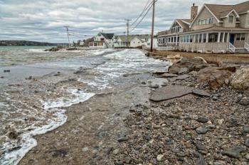 Waves wash up into the road near Ocean Point Inn. Courtesy of Mike Leonard