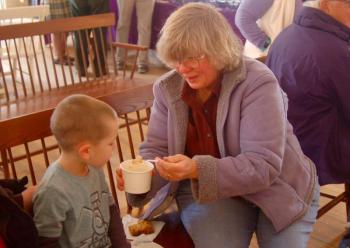 Debbie Williams shares cock-a-leekie soup with grandson Connor. ART MAYERS/Boothbay Register