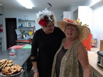Center Director Jane Good, left, and the Rotary’s Debbie Graves share a laugh in the Rotary clubhouse kitchen during the 2018 Kentucky Derby party. JANE CARPENTER/Boothbay Register