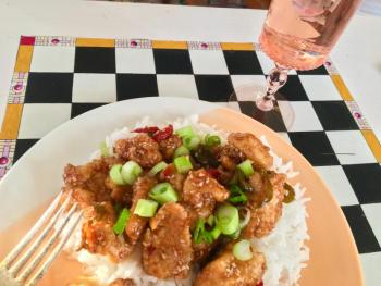 Crispy sesame chicken with a sticky Asian sauce paired with a beautiful pink glass of rose. SUZI THAYER/Boothbay Register