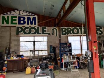 Vintage signs from Boothbay Harbor adorn the walls of Hyson’s shop. SUZI THAYER/Boothbay Register