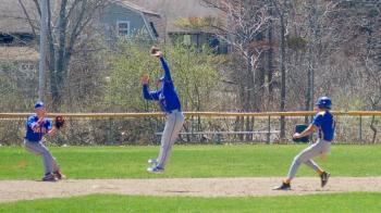 Oak Hill's second baseman leaps high to cut down a Seahawk runner. ART MAYERS/Boothbay Register