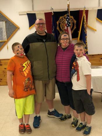 The Smiths - Ethan, Joshua, Sarah and Griffin - opt for a Kodak moment after Webelo Ethan and Wolf Griffin received their Bobcat Award, the 1st badge they must receive to move onto their respective ranks. Courtesy of Robin Ford