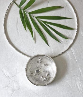 Christine Peters’ reticulated circle pendant/pin/necklace with aquamarine. Courtesy of Christine Peters Christine Peters