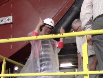 Deborah Murray christens the new tugboat. ART MAYERS/Boothbay Register