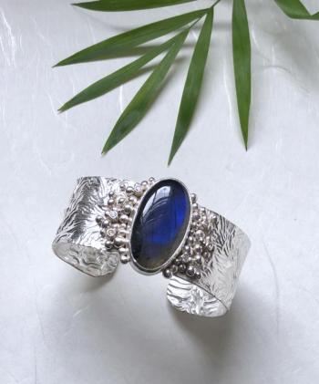 Reticulated silver cuff bracelet with baubles, labradorite and topaz by Christine Peters. Courtesy of Christine Peters Christine Peters