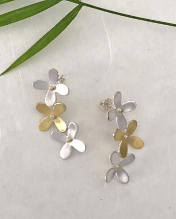 Silver and gold hydrangea floral stud earrings by Christine Peters. Courtesy of Christine Peters Christine Peters