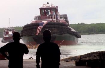 Workers watch as the Judy Moran slips into the water. ART MAYERS/Boothbay Register