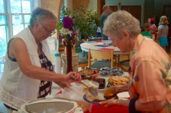 Jackie Pinard serves lunch to Miriam Wade. ART MAYERS/Boothbay Register