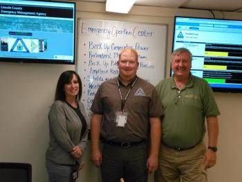 From left, Deputy Director of Lincoln County EMA Melissa Temple, Director Casey Stevens and Training and Operations Specialist Ken Desmond open the new emergency operations center July 19. JANE CARPENTER/Boothbay Register