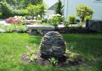 Founder’s Garden stone egg sculpture by Matt Spurgin. LISA KRISTOFF/Boothbay Register