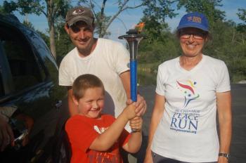 Brady Griffin tries carrying the torch at Moody’s Diner Aug. 9. ART MAYERS/Wiscasset Newspaper