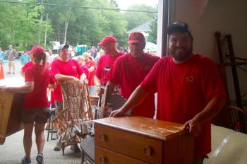 Volunteers line up auction items. ART MAYERS/Boothbay Register