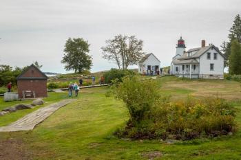 Cruise participants head toward the lighthouse on Burnt Island. Mike Leonard photo