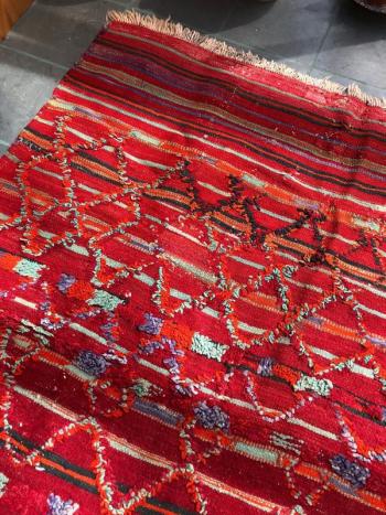 A rare red Talsint area rug at Gleason Fine Art. Courtesy of Kathleen Jones