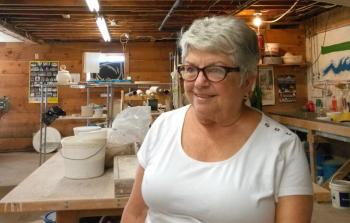 Annette Stormont helps students learn the art of pottery at the River Arts studio in Damariscotta. JANE CARPENTER/Boothbay Register