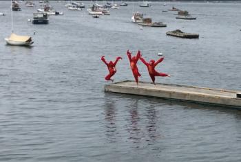 Y-Arts staff (Roosevelt Bishop, Taylor Fish and Jackie McLoon) jump off the dock at Cap’n Fish’s Waterfront Inn for the final scene in “I Love Maine, Movie Musical.” The film will play at the Harbor Theater Nov. 3. Courtesy of Emily Mirabile