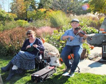 Fiddler Owen Kennedy, 13, and his mom Christina Kennedy at The Great Pumpkin Hunt. LISA KRISTOFF/Boothbay Register The Great Pumpkin Hunt at Coastal Maine Botanical Gardens Oct. 20.