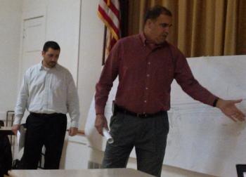 MDOT engineer Matt Philbrick, left, and senior project manager Ernie Martin point out sections of the Routes 1 and 27 project map at the Oct. 22 public hearing. JANE CARPENTER/Boothbay Register